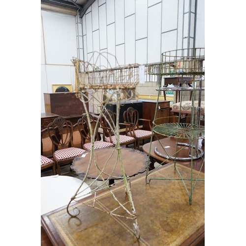 1050 - Two Victorian painted wirework pot stands, larger height 90cm