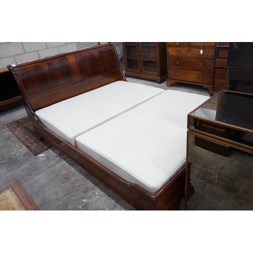 1057 - An 'And So To Bed' mahogany kingsize sleigh bed with Prestige two section divan base, width 161cms, ... 