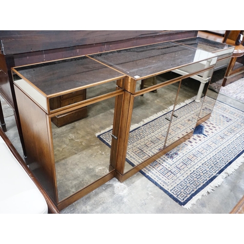 1059 - A contemporary mirrored walnut breakfront four door sideboard, width 200cms, depth 50cms, height 86c... 