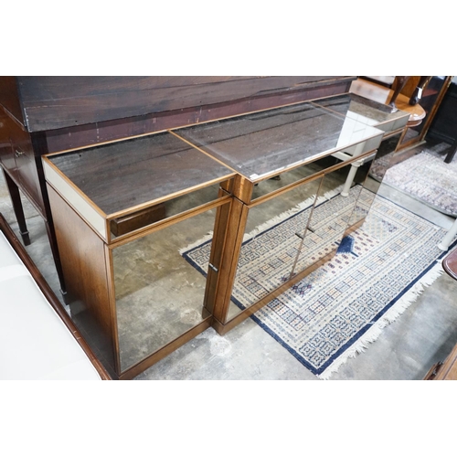 1059 - A contemporary mirrored walnut breakfront four door sideboard, width 200cms, depth 50cms, height 86c... 