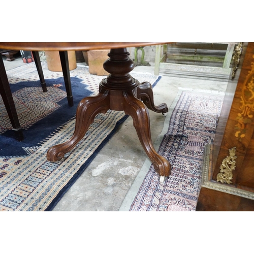 1063 - A Victorian mahogany oval tilt-top loo table width 134cms, depth 104, height 72cms.