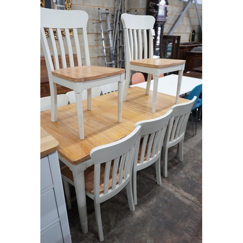 1068 - A modern John Lewis part painted extending dining table and eight matching chairs, table width 209cm... 