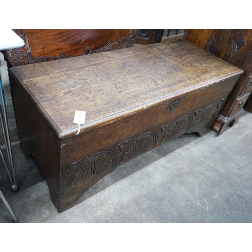 1069 - A late 17th / early 18th century carved six plank oak coffer width 115cms, depth 44cms, height 50cms... 