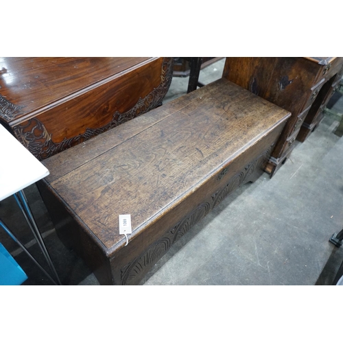 1069 - A late 17th / early 18th century carved six plank oak coffer width 115cms, depth 44cms, height 50cms... 