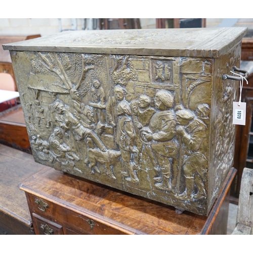 1070 - A Dutch style brass repousse log box, width 79cms, depth 35cms, height 57cms.