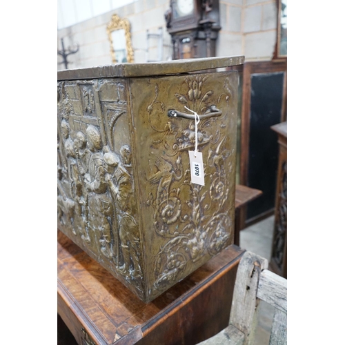 1070 - A Dutch style brass repousse log box, width 79cms, depth 35cms, height 57cms.