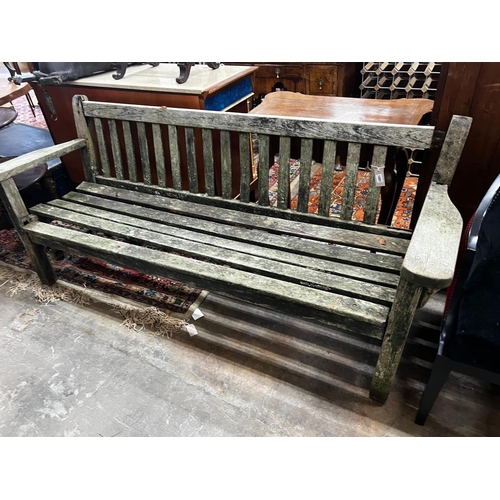 1072 - A weathered teak garden bench, length 194cm, height 83cm (a.f.)