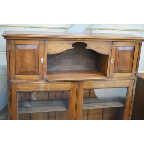 1081 - A Victorian style glazed walnut bookcase width 110cms, depth 26cms, height 136cms.