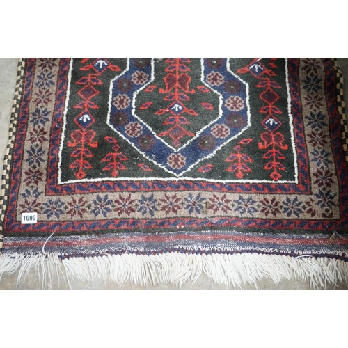 1090 - A Belouch blue ground prayer rug, 140 x 74cm