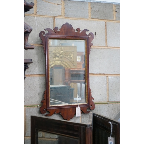 1094 - A George III style mahogany fret cut wall mirror width 45cms, height 75cms.