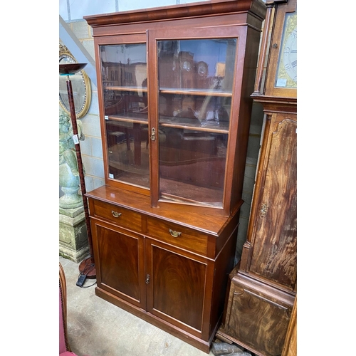 1098 - A late Victorian mahogany bookcase cupboard, width 108cm, depth 52cm, height 215cm