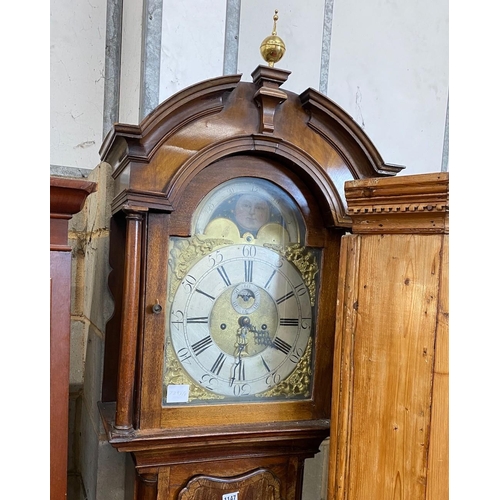 1099 - A George III mahogany eight day longcase clock, with an arched brass dial, height 246cm