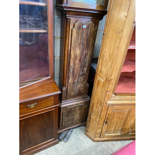 1099 - A George III mahogany eight day longcase clock, with an arched brass dial, height 246cm