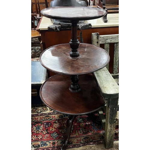 1103 - A George III and later circular mahogany three tier dumb waiter, height 108cm