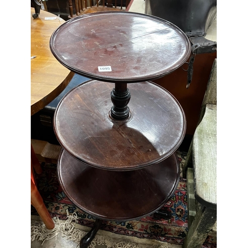 1103 - A George III and later circular mahogany three tier dumb waiter, height 108cm