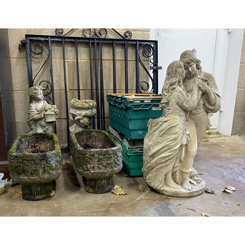 1105 - A small pair of rounded rectangular garden planters, a bird bath and two garden figures