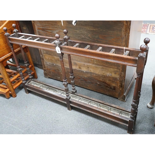 1125 - A large Victorian oak club stickstand, with zinc drip trays, width 122cm, depth 14cm, height 77cm... 