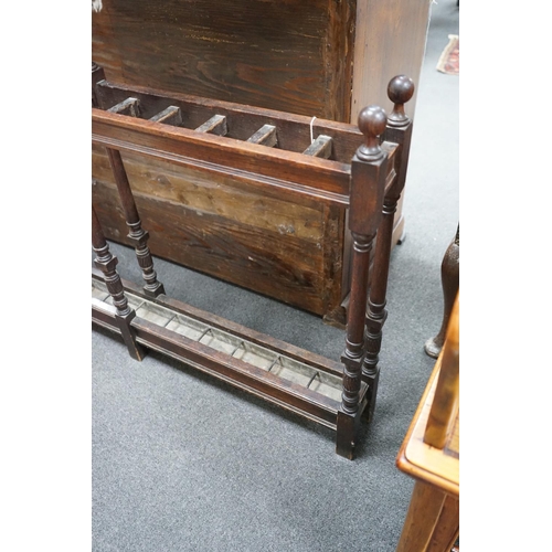 1125 - A large Victorian oak club stickstand, with zinc drip trays, width 122cm, depth 14cm, height 77cm... 