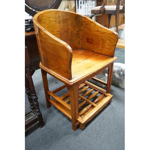 1126 - A pair of Chinese elm armchairs with roller footrests, width 57cm, depth 53cm, height 89cm