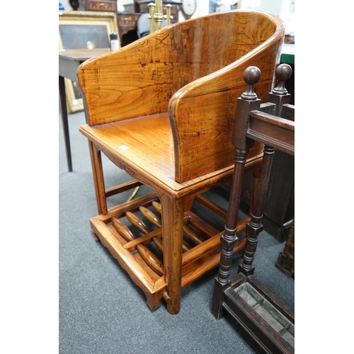 1126 - A pair of Chinese elm armchairs with roller footrests, width 57cm, depth 53cm, height 89cm