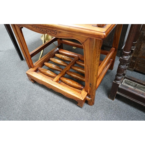 1126 - A pair of Chinese elm armchairs with roller footrests, width 57cm, depth 53cm, height 89cm