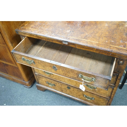 1129 - An early 18th century style feather banded walnut bachelor's chest, width 76cm, depth 34cm, height 7... 