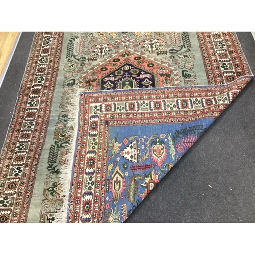 1130 - A Turkish faded blue ground carpet, 264cm x 170cm