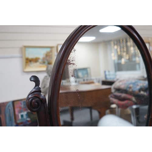 1131 - A Victorian mahogany toilet mirror with compartment base, width 66cm, height 82cm