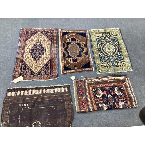 1138 - An antique Hamadan mat, a Kurdish mat and three others, largest 92cms x 60cms.