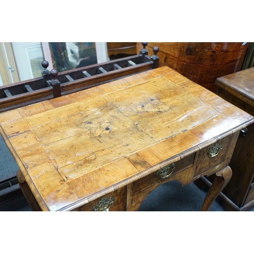 1150 - A George I walnut lowboy with quarter veneered top, width 87cm, depth 55cm, height 74cm