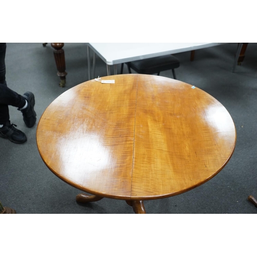 1153 - A Victorian circular satin birch tilt top tea table with bird cage action, diameter 84cm, height 70c... 