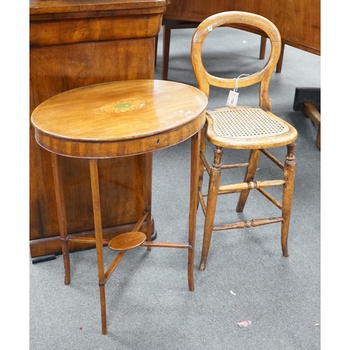 1154 - A Victorian caned beech child's correction chair and an Edwardian inlaid mahogany oval occasional ta... 