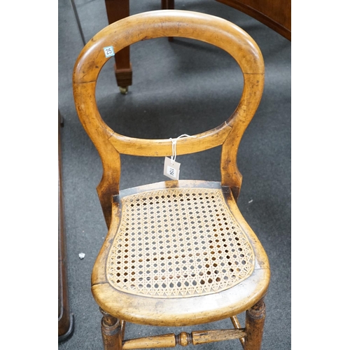 1154 - A Victorian caned beech child's correction chair and an Edwardian inlaid mahogany oval occasional ta... 