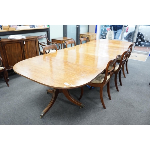 1155 - A George IV mahogany triple pedestal extending dining table, length 341cm extended, two spare leaves... 