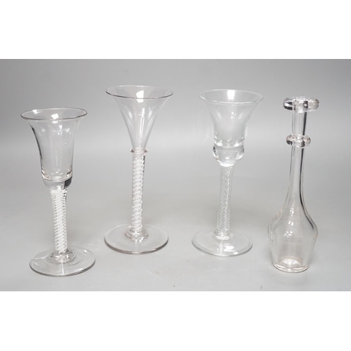 1252 - Three opaque or airtwist stem drinking glasses together with a Toddy lifter - 18cm high