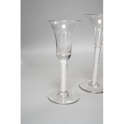 1252 - Three opaque or airtwist stem drinking glasses together with a Toddy lifter - 18cm high