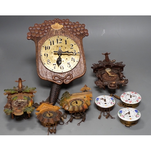 1261 - An early 20th century German Jugendstil oak wall timepiece, four miniature Black Forest timepieces a... 