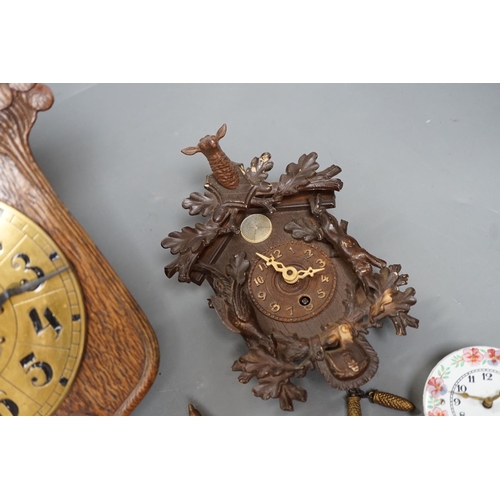 1261 - An early 20th century German Jugendstil oak wall timepiece, four miniature Black Forest timepieces a... 