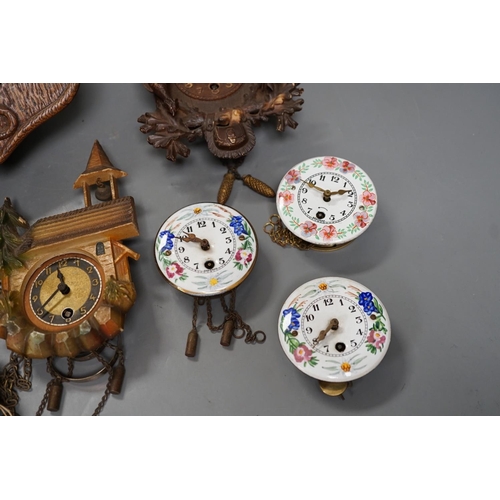 1261 - An early 20th century German Jugendstil oak wall timepiece, four miniature Black Forest timepieces a... 