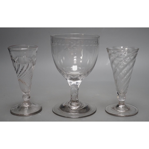 1264 - Two wrythen ale flutes, 18th century and a facet stem OXO glass rummer, tallest 15cms high