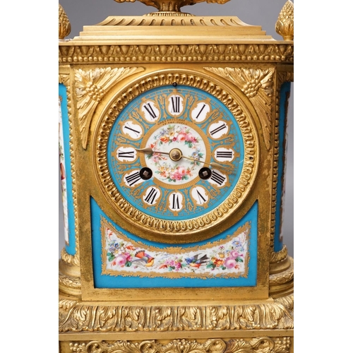 1271 - A French ormolu mantel clock, with inset floral decorated porcelain plaques and dial, 40cms high... 