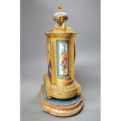 1271 - A French ormolu mantel clock, with inset floral decorated porcelain plaques and dial, 40cms high... 