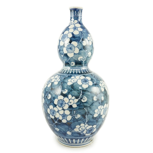 1272 - A Japanese blue and white 'prunus' double gourd sake flask, late Edo period, height 32cms  31.5cm hi... 