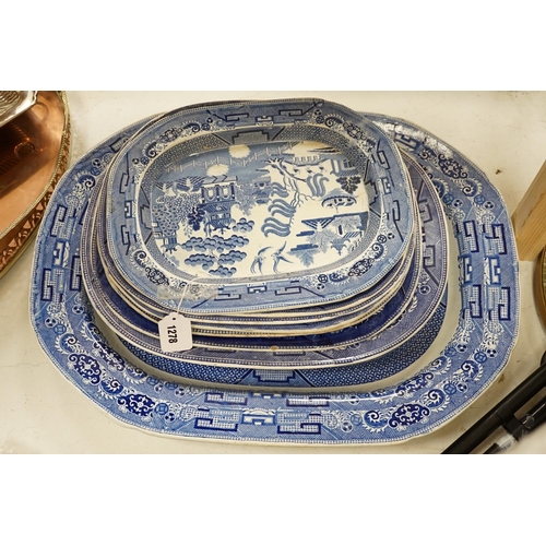 1278 - A 19th century transfer-printed large blue and white platter and seven similar smaller platters (8),... 