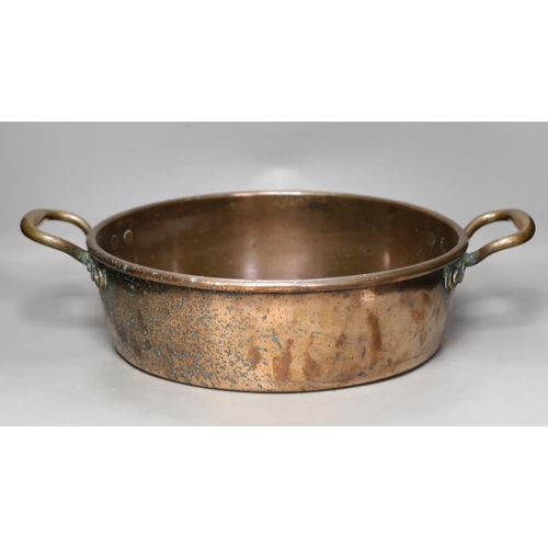 1281 - A 19th century copper two handled preserving pan, 51cms handle to handle