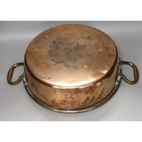 1281 - A 19th century copper two handled preserving pan, 51cms handle to handle