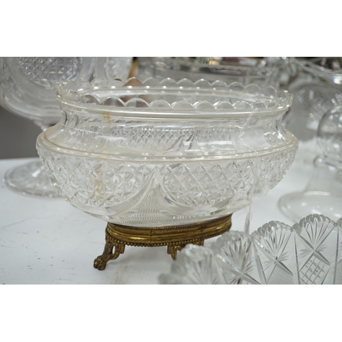 1289 - An early 20th century oval cut glass bowl on gilt metal stand, a pair of slice cut decanters and sto... 