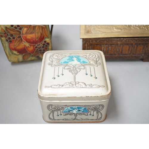 1302 - A Jacobs embossed coffer shaped biscuit tin, 16cm wide, a Pomegranate design tin after Moorcroft and... 