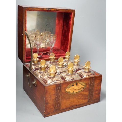 1308 - A 19th century Dutch inlaid mahogany decanter box containing nine gilt glass decanters and two glass... 