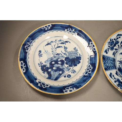 1312 - Two 18th century Dutch Delft blue and white plates, largest 23cms diameter